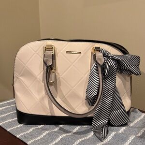 ALDO: Elegant Cream and Black Handbag with Bow and Lock Accent